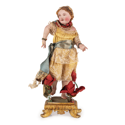 FIGURA IN LEGNO E STOFFA, NAPOLI, XIX SECOLO raffigurante il Bambinello in abito ricamato, con colla