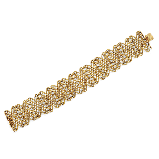 BRACELET JONC SEMI-ARTICULÉ EN OR composé de maillons ondulés entrelacés en or en forme dun cord