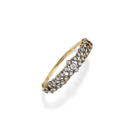 BRACELET ANCIEN EN OR JAUNE ET DIAMANTS  Bracelet rigide en or jaune et argent serti de diamants ron
